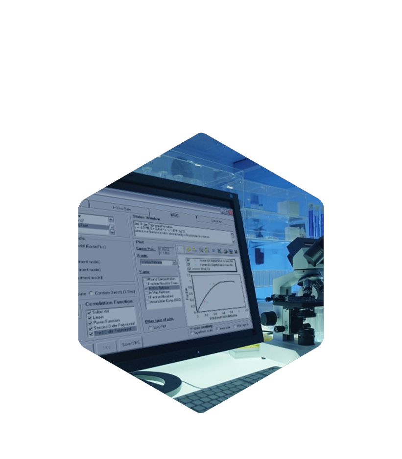 A monitor shows scientific data, PK/PD modeling with GastroPlus by Simulations Plus, in a blue-toned lab.