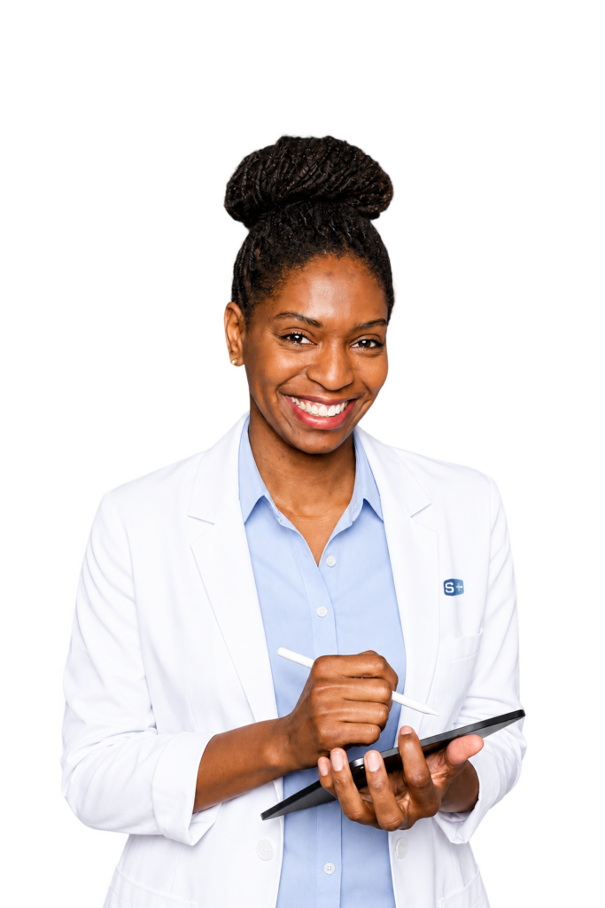 Smiling woman in lab coat reviews ADMET data with ADMET Predictor® by Simulations Plus on tablet.