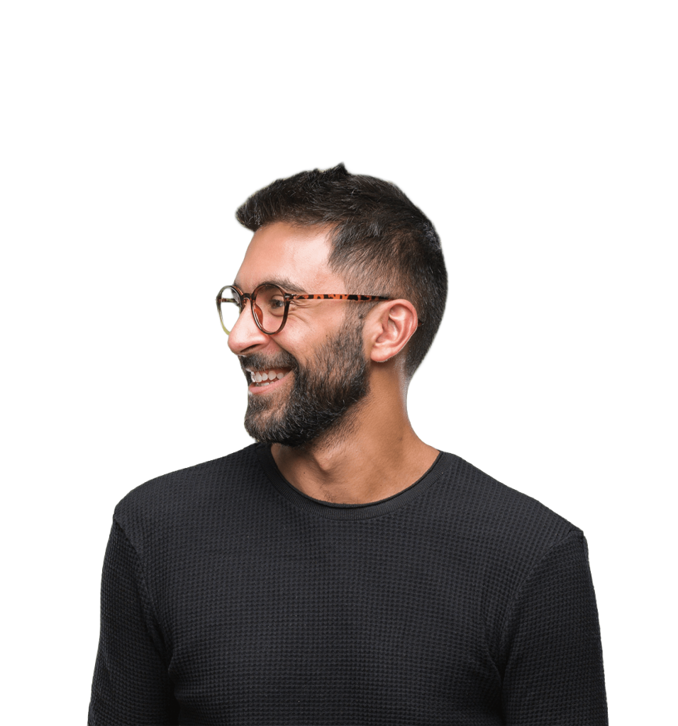 A confident man, ideal for PBPK modeling and DILIsym services, smiles left in a black shirt on white.