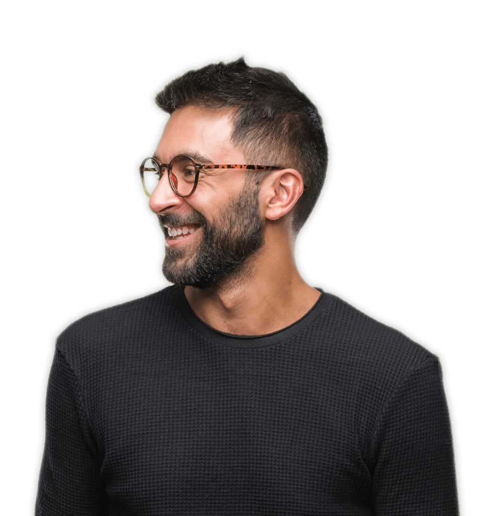 A man in glasses and a black shirt ponders Simulations Plus modeling and simulation tools.